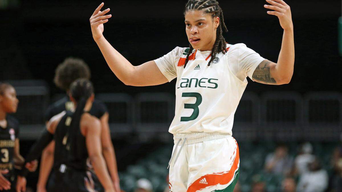 Miami Hurricanes forward Destiny Harden (3) attempts to motivate the fans during the game against Florida State Seminoles at the Watsco Center in Coral Gables, Fl. on Thursday, February 9, 2023.