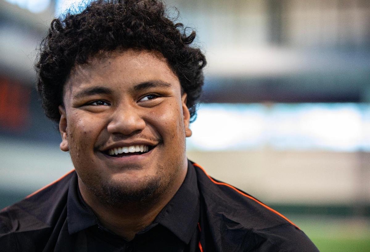 Miami Hurricanes Offensive Line Francis Mauigoa talks to reporters during UM Football Media Day at Carol Soffer Indoor Practice Facility on Monday, July 31, 2023 in Coral Gables, Fla.