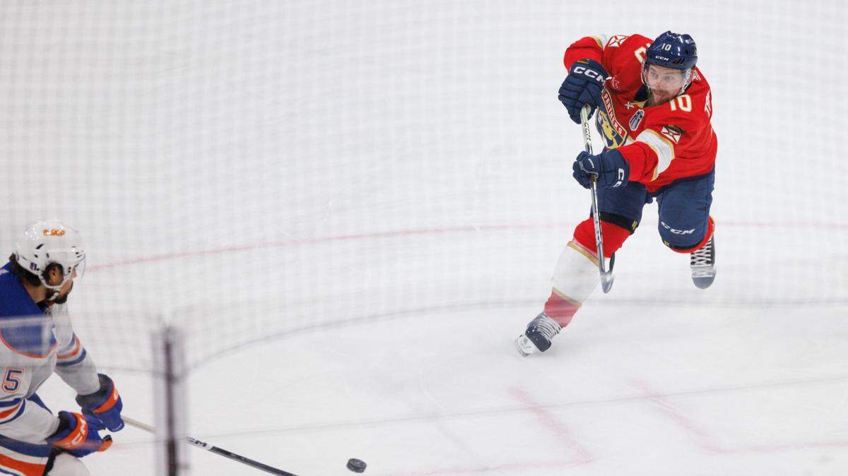 Florida Panthers right wing Vladimir Tarasenko (10) shoots the puck around Edmonton Oilers defenseman Cody Ceci (5) during the first period of Game 5 of the NHL Stanley Cup Final at the Amerant Bank Arena on Tuesday, June 18, 2024 in Sunrise, Fla.