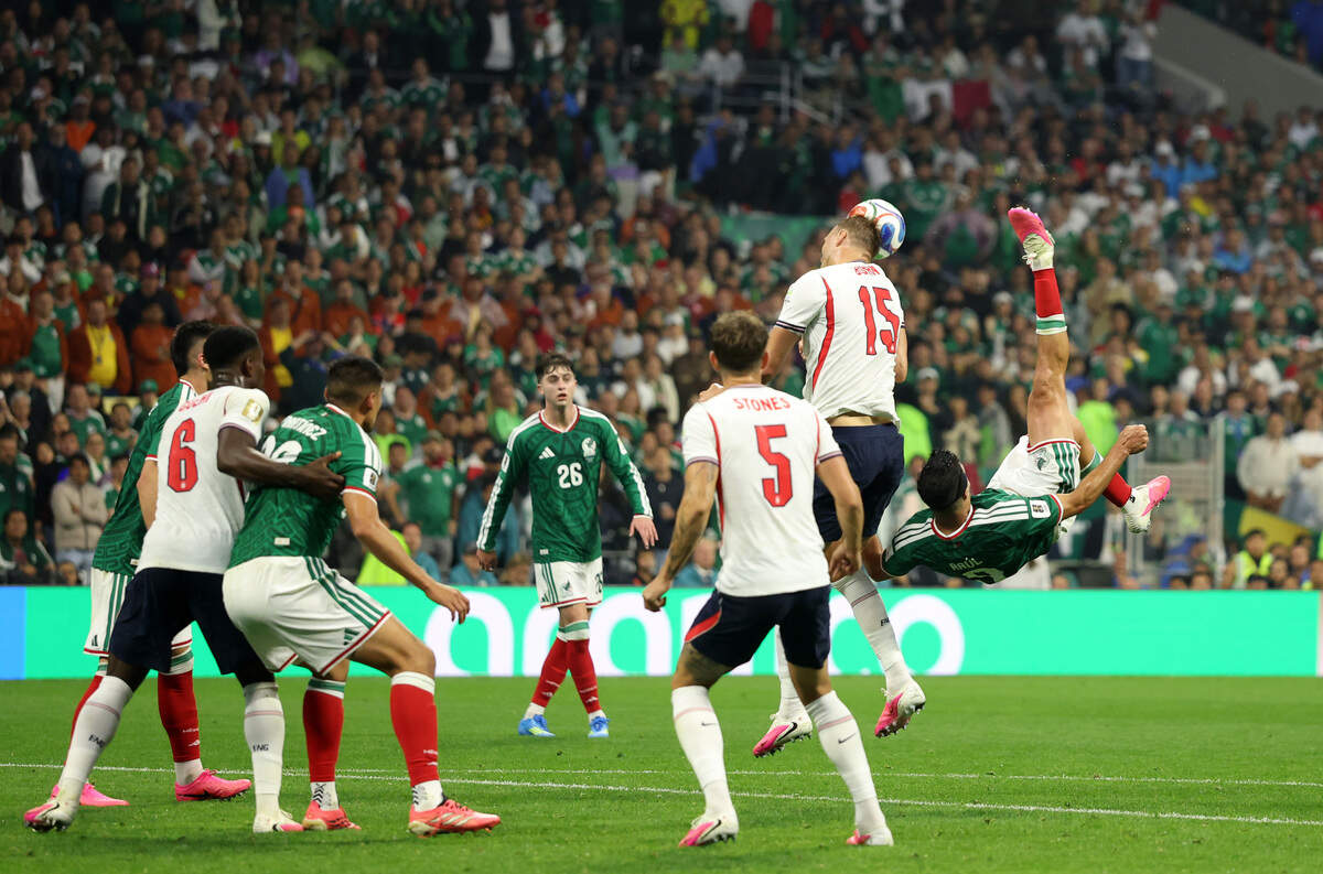 MEXICO CITY, MEXICO - JULY 05: Raul Jimenez #9 of Mexico attempts an overhead kick against Dan Burn #15 of England during the FIFA World Cup 2026 Round of 16 match between Mexico and England at Mexico City Stadium on July 05, 2026 in Mexico City, Mexico. (Photo by Michael Steele/Getty Images)
