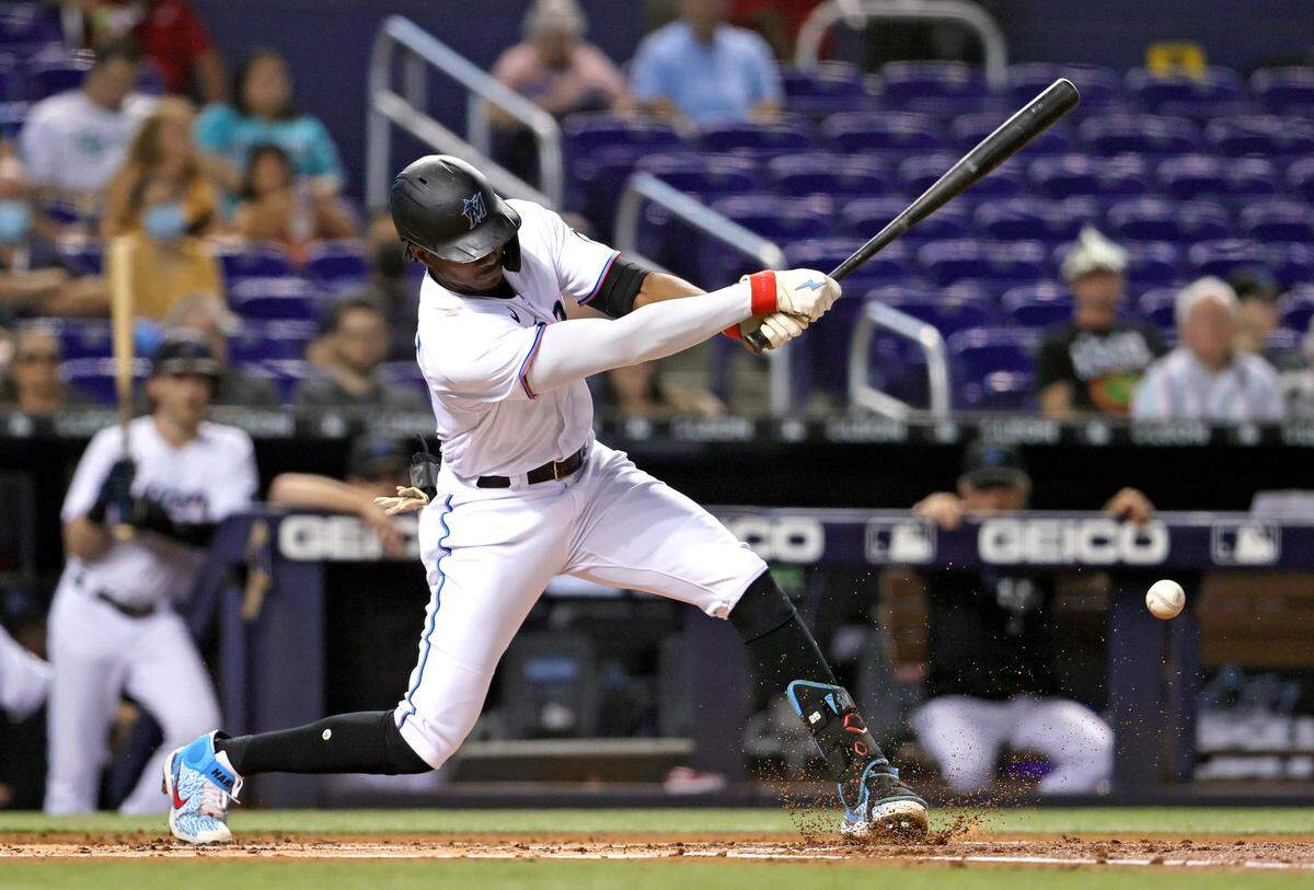 Miami Marlins center fielder Lewis Brinson (25) grounds into force out during the first inning of their baseball game against the Washington Nationals at loanDepot park on Thursday, August 26, 2021 in Miami, Florida.