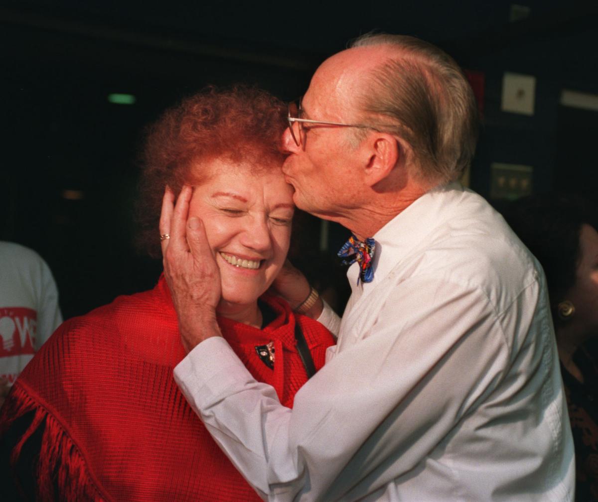 A kiss for wife Edith from Seymour Gelber in 1995, after he won the mayoral race once again.