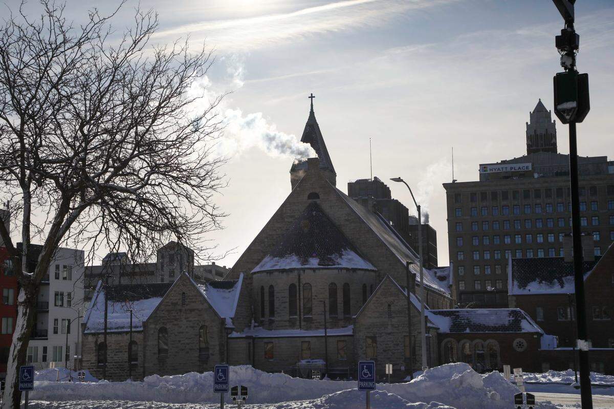 Steam emerges from a stack at the St. Ambrose Cathedral in downtown Des Moines on Sunday, Jan 14, 2023, where temperatures plummeted to -14 degrees (F) overnight on the heels of an arctic blast that swept across the country over the weekend.