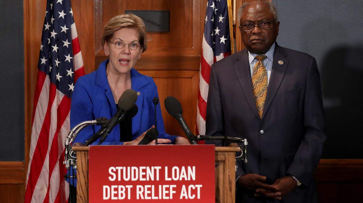 U.S. Sen. Elizabeth Warren, with Jim Clyburn, speaks during a press conference on student debt in 2019.
