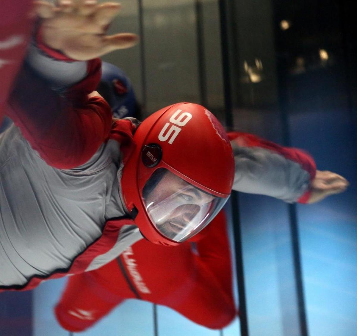 Instructors steady Reinaldo Maiz, 28, who is physically challenged.