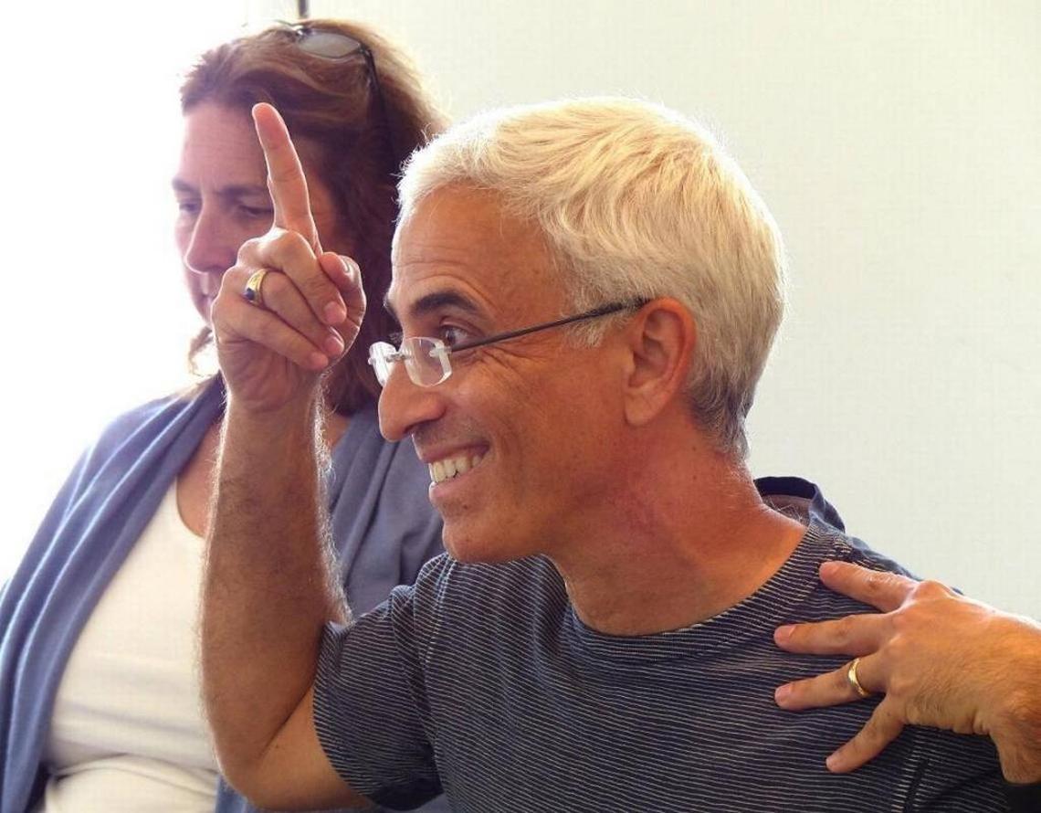 Scott Rogers of the University of Miami, here leading a group meditation at the Lowe Art Museum, will be in conversation with Daniel Goleman at Miami Dade College.