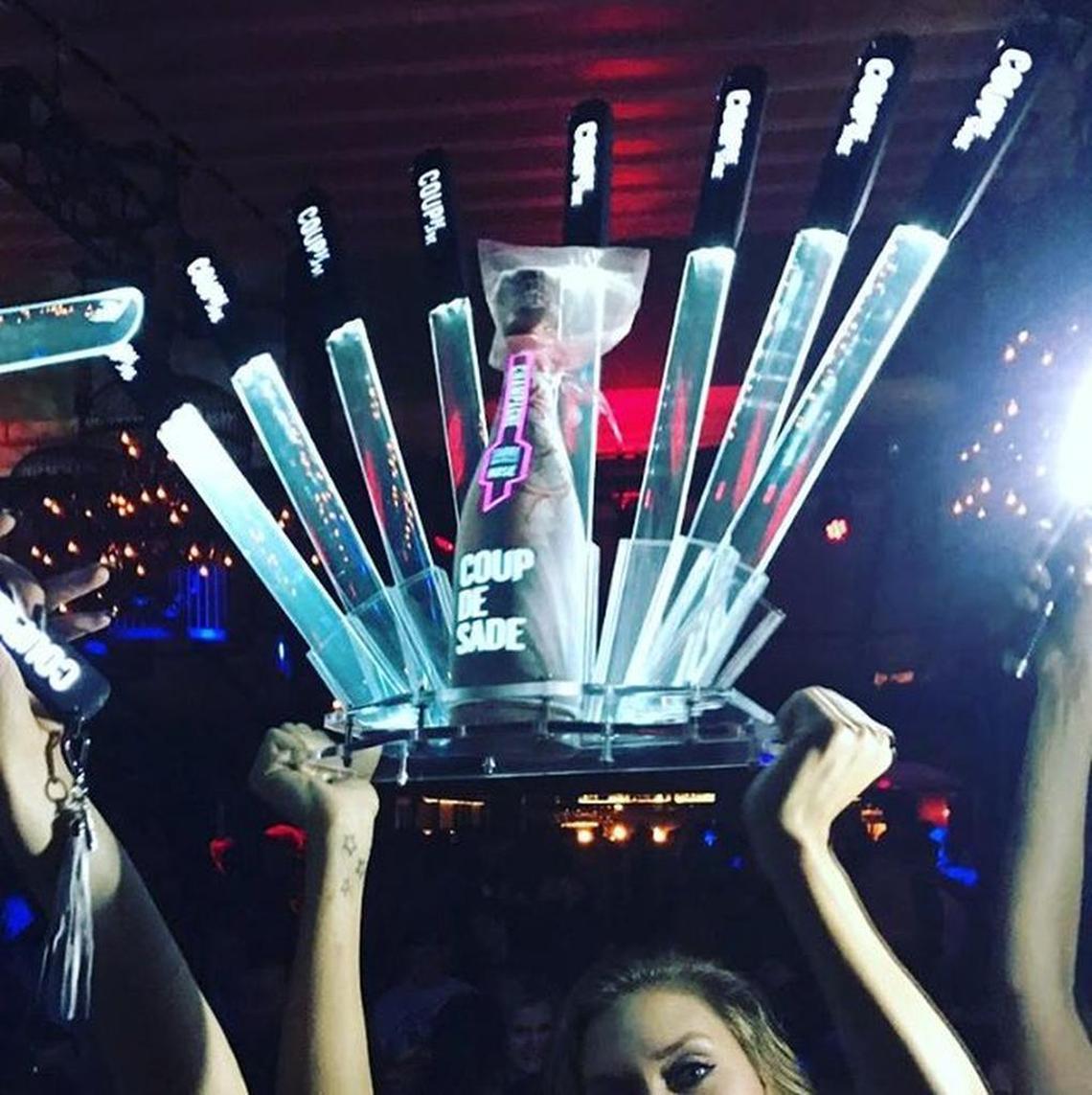 Coup De Sade’s nightclub version of its champagne that can be safely sabered is called Blaze. The bottle and the saber tools glow.