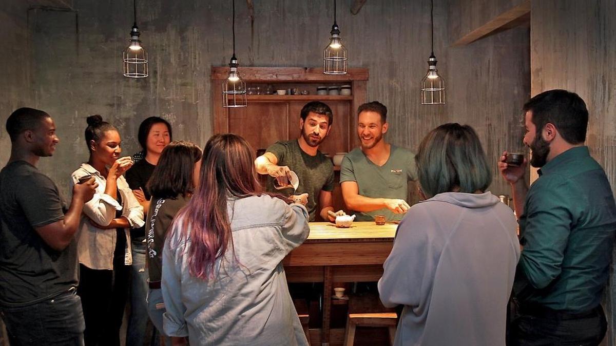 Mike Ortiz (right) and Tico Aran take guests through flights of different teas, from mild to powerful, at JoJo Tea’s hidden tasting room in a nondescript medical office near Little Havana.