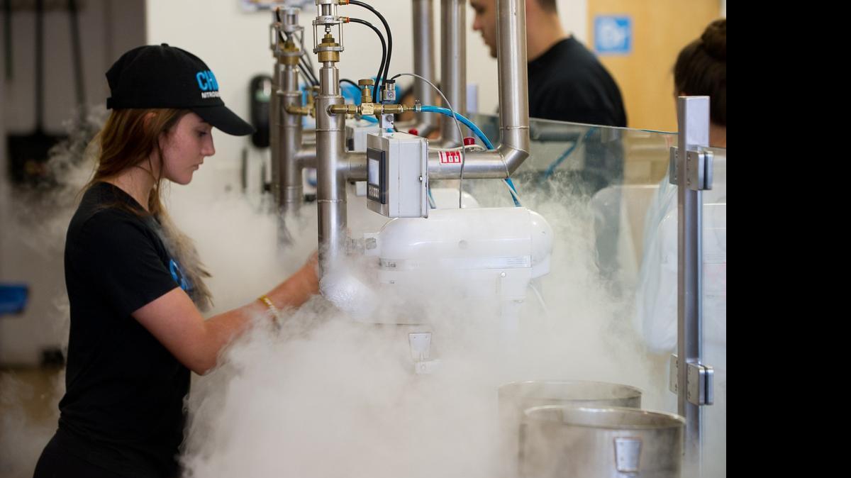 
Chill-N: Manager Brittany Anderson freezes ice cream with a blast of liquid nitrogen at Chill-N Nitrogen Ice Cream in Pinecrest.
