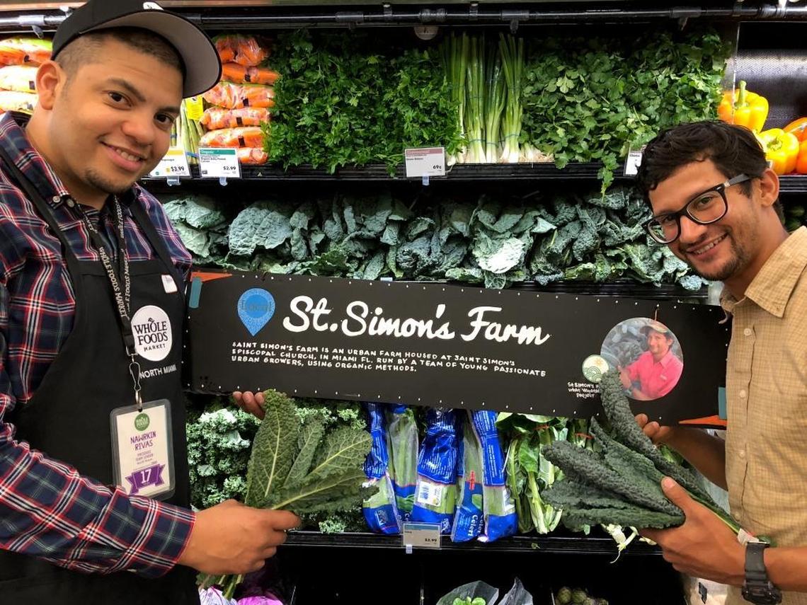 Moses Kashem, right, drops off a delivery of fresh vegetables to Nawrkin Rivas at Whole Foods Market in North Miami. Kashem grows vegetables at an urban organic farm he founded on unused land surrounding St. Simon’s Episcopal Church in suburban Miami. That produce is now available at Whole Foods in North Miami.