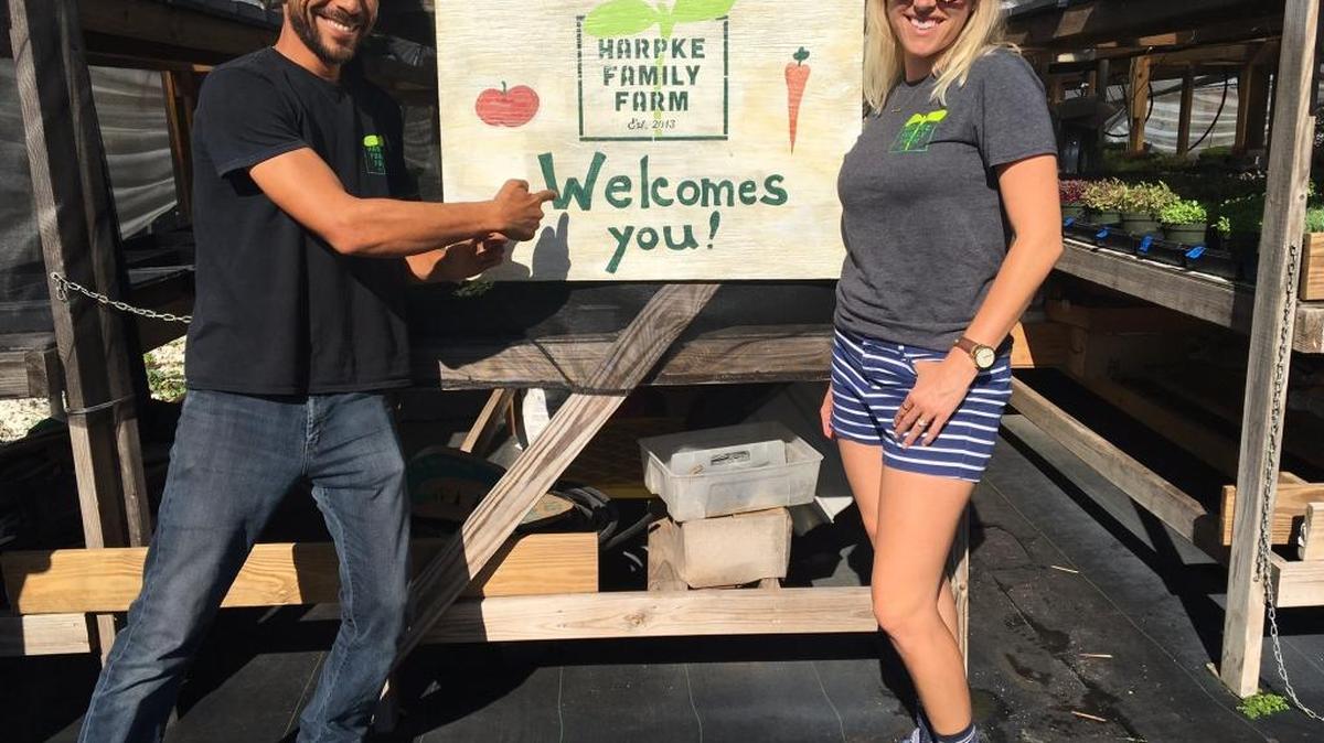 Tamer Harpke and his wife, Claire, at their farm Harpke Family Farm in Dania Beach on Tuesday, April 7.