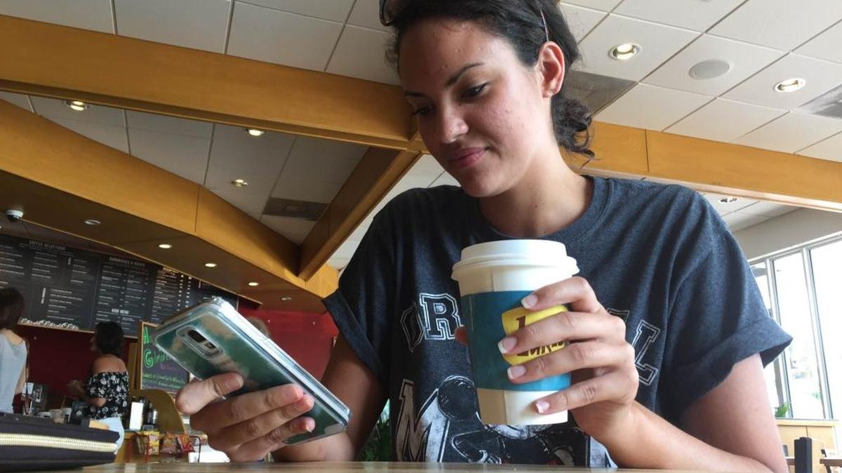 Adina Martinez, 22, sips a “Luke’s Diner” coffee at Alaska Coffee Roasting Company in North Miami on Wednesday. The themed coffees were part of a promotional effort for Netflix’s new season of “Gilmore Girls.”