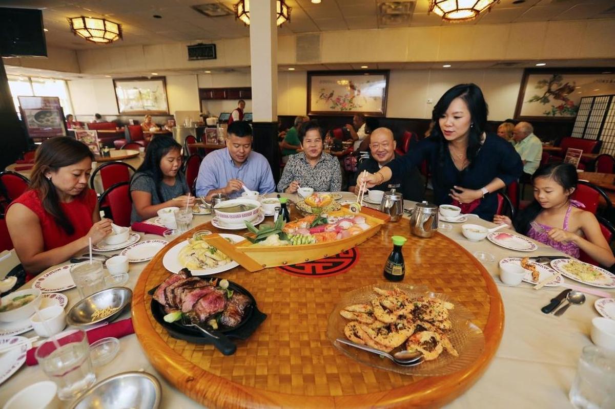 From left, Iva Ng, Lindsay Ng, Abe Ng, Betty Ng, Allan Ng, Christina Ng and Jacquelyn Ng at the Canton Restaurant in Coral Gables on Saturday, May 27, 2017.