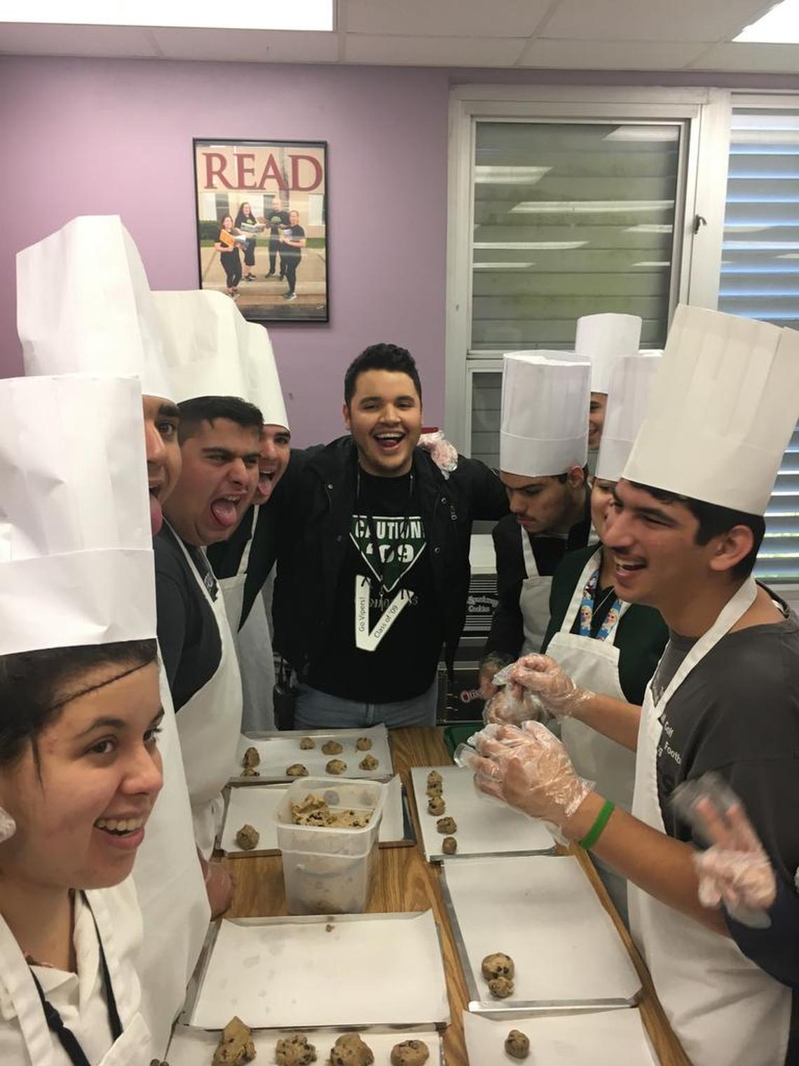 Chef Chris Valdes taught a baking class to students in the autism program at Felix Varela High School in West Kendall as part of his returning to the school as Principal of the Day. He was a 2009 graduate of the school.