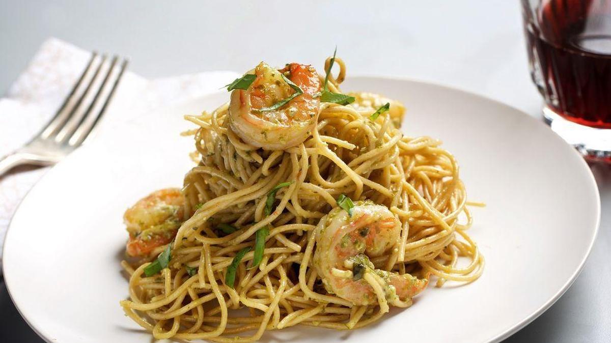 Spaghetti with shrimp and basil pesto.