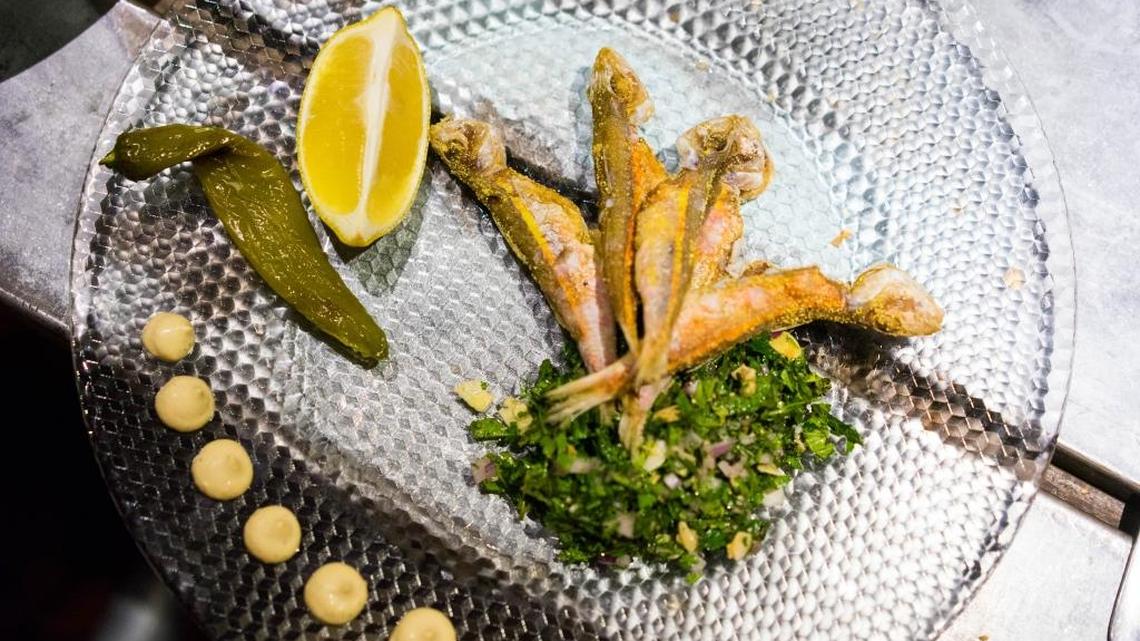 A dish of crispy sardines and herb salad at Yudale, a tapas-style bar run by the same owners of Machneyuda, one of Israel’s best restaurants.