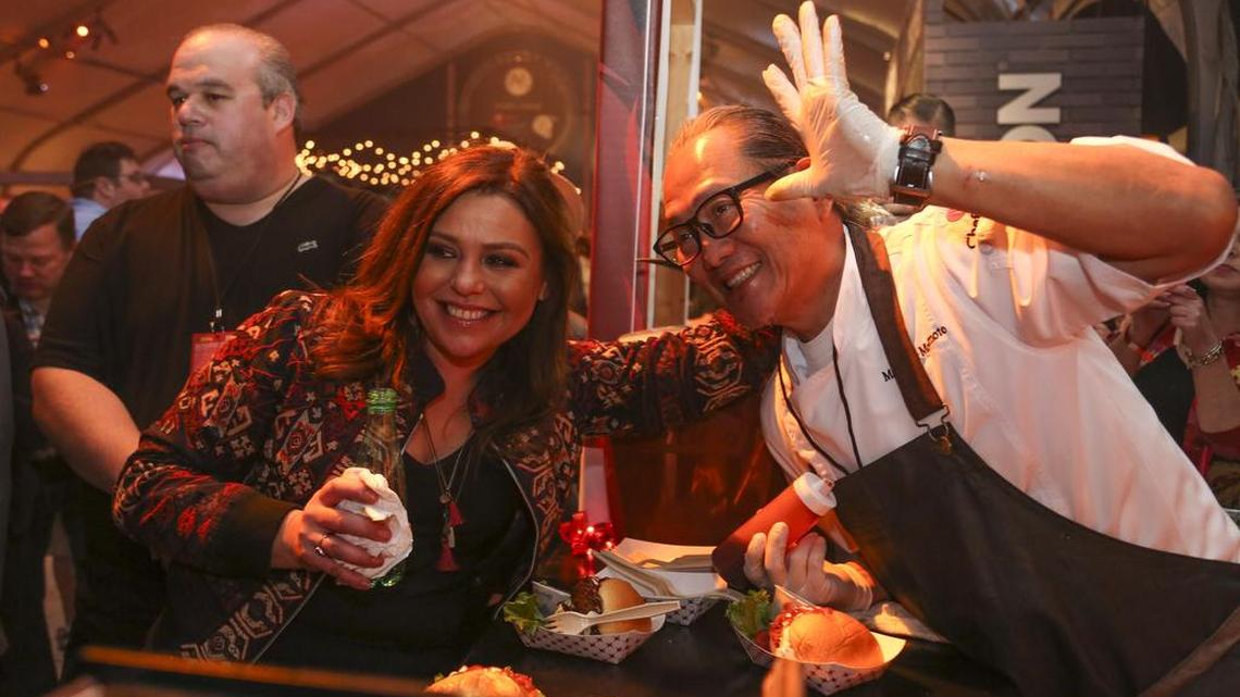 Rachael Ray and Masaharu Morimoto pose for a picture at during Burger Bash at the 2016 South Beach Wine & Food Festival on Friday, Feb. 26, 2016.