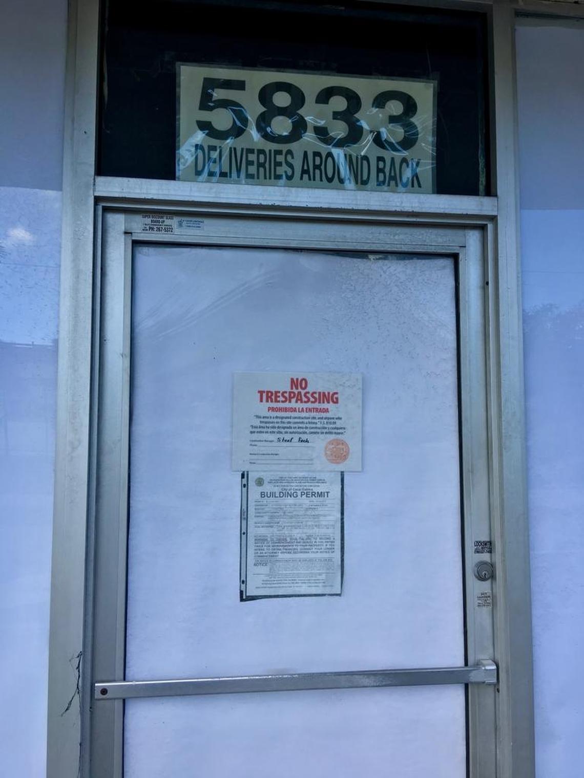 A building permit at 5833 Ponce de Leon Blvd. in Coral Gables, near the Titanic, is tacked to the door of the coming new location for Miami’s Best Pizza in winter 2018 on University of Miami property.