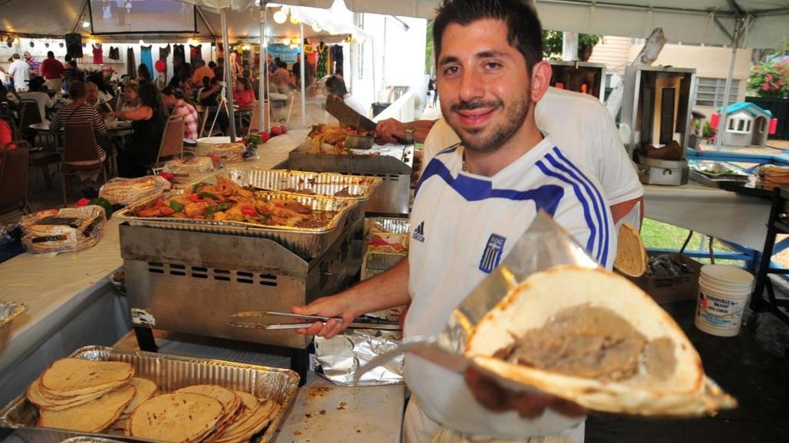Parishioner Alex Karavias shows off traditional delicacies to be served this weekend at Saint Sophia Greek Festival, 244 SW 24th Rd. in Miami’s Roads neighborhood.