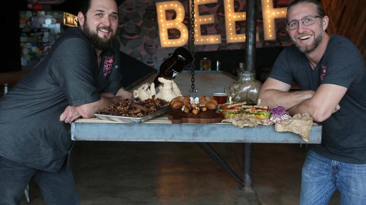 The two founders of Miami Smokers restaurant, James Bowers (right) and Andres Barrientos (left), at their Little Havana shop, which will be on Guy Fieri's “Diners, Drive-ins and Dives” on May 27, at 10 p.m. on the Food Network.