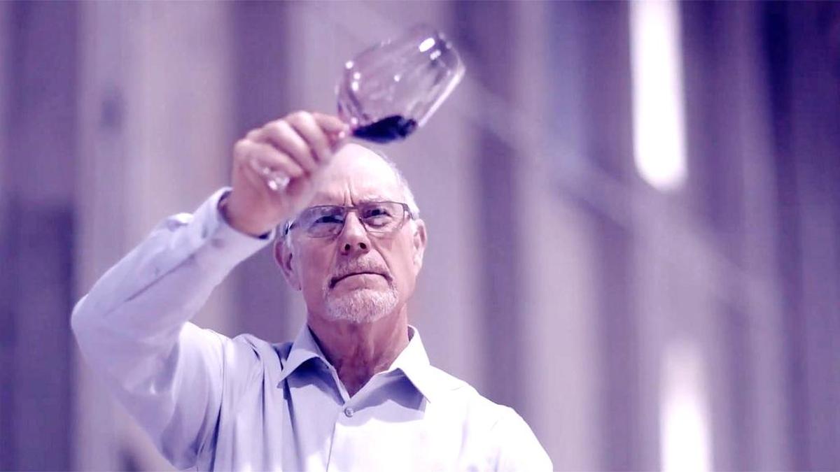 Winemaker Jon Moynier inspects a glass of Purple Heart.