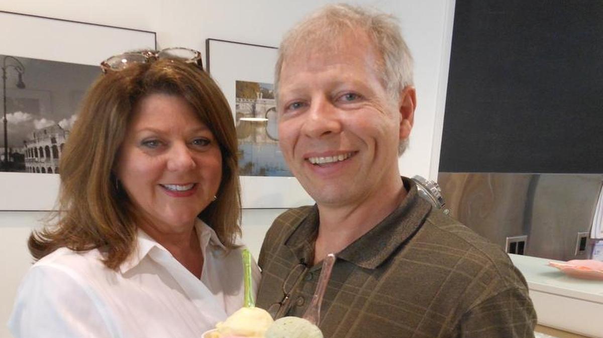 Gail Sosby and Robert Klemm with cups of gelato at their place, Amore Gelato Art Caffe in Coral Gables.