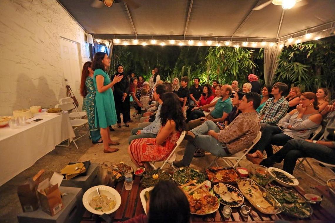 Supper club organizer Kate Cruz thanks the participants who helped with the supper club that raises funds for Syrian refugees in the South Florida community on April 22.