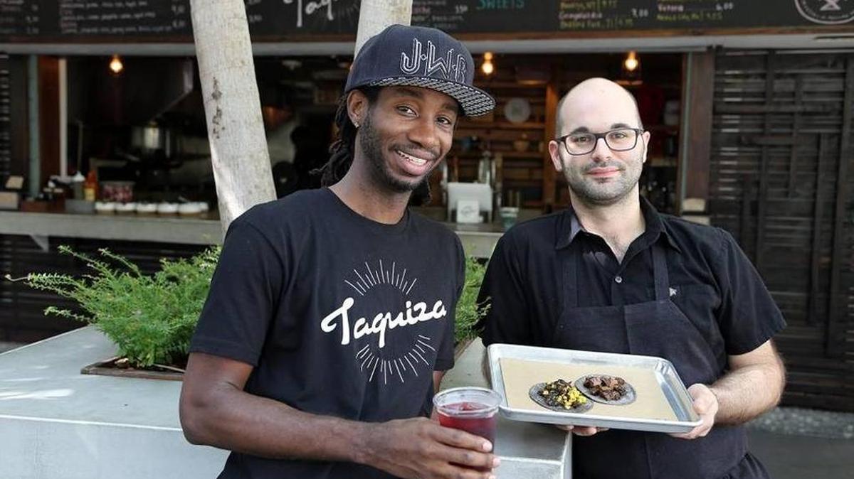 Washington Charles, left, and Steve Santana of Taquiza in Miami Beach.