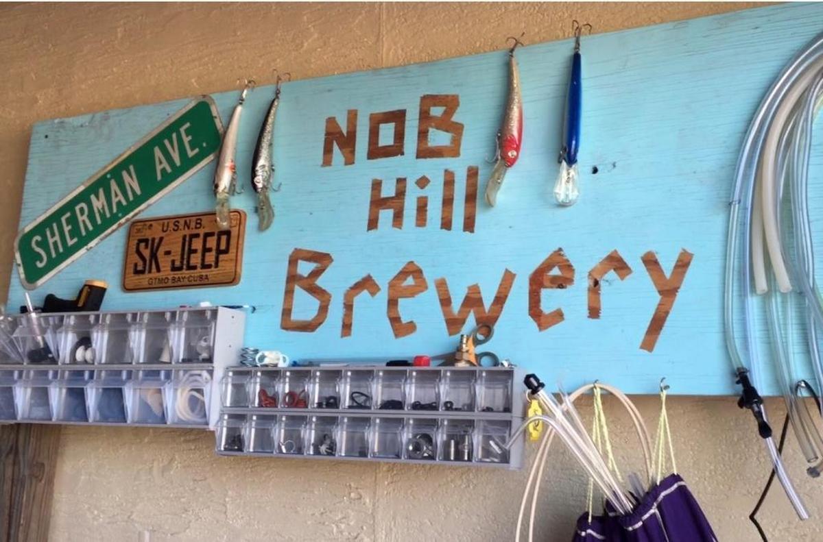 A sign on the wall in the garage of Stephen Prestesater’s Nob Hill neighborhood home, Ground Zero for the U.S. Navy base’s Homebrewers Association.