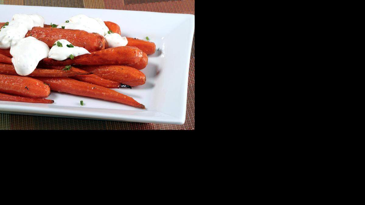 
Roasted carrots: They take on an earthy, herbal note with the additions of rosemary butter and black-pepper crème fraîche. 
