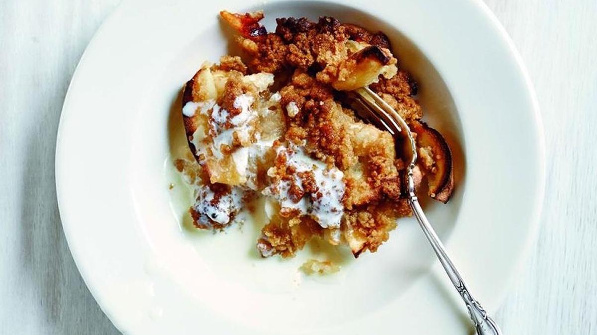 Ruth Reichl’s Apple Crisp starts with freshly picked heirloom apples and is served warm with a pour of cream.