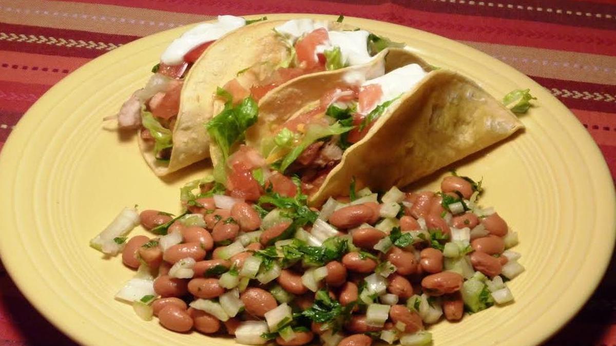 Make chicken tacos with pinto bean salad fast by using prediced tomatoes and celery and shredded cheese.