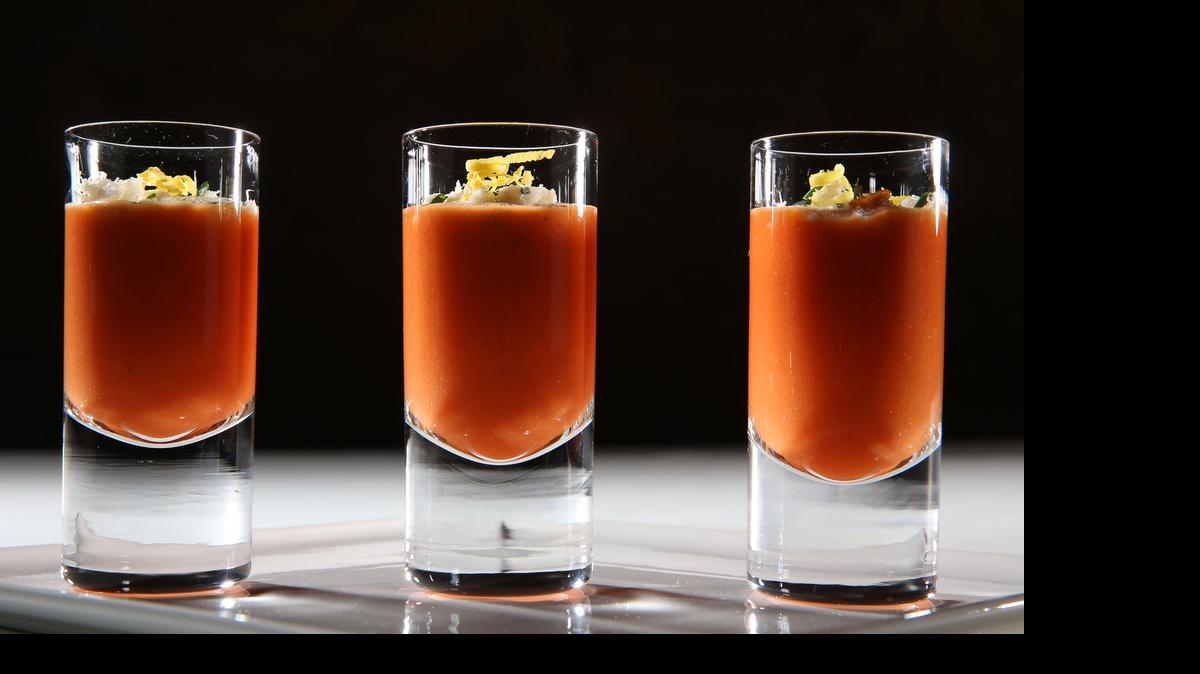 
Take your best shot: Gazpacho becomes a shooter, topped with buttery fresh crab and chives. 
