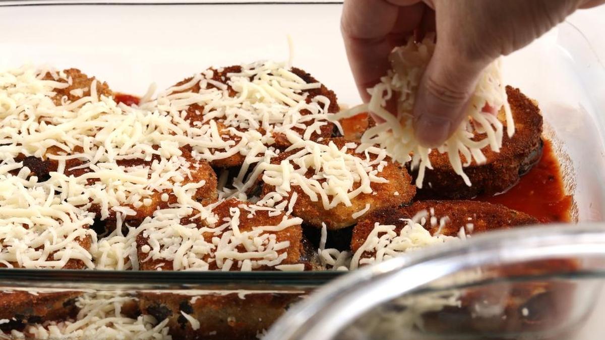 Spread mozzarella liberally, but not excessively, over the eggplant. For the mozzarella, you can slice fresh mozz or get good quality bricks to shred. And, if you’re partial to those bags of pre-shredded mozzarella? Go ahead.