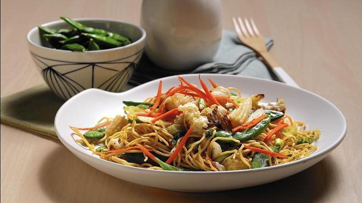 Fresh ginger and raw sliced scallions form a sauce to punch up noodles. Garnish as you like with bamboo shoots, quick-pickled cucumbers, roasted cauliflower or any other vegetables.