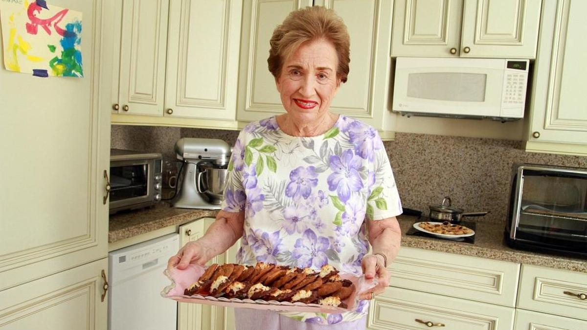 Sandra Davis, 82, holds a tray of her freshly baked cookies in her apartment in Coral Gables on Dec. 1. Her reputation as The Cookie Lady started almost immediately after she moved into The Palace senior living community. Using fresh ingredients — and butter — are important to making great-tasting cookies, she says.