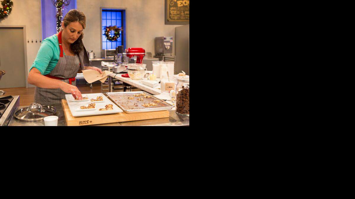 
Naylet LaRochelle of Miami-Dade plates her dishes during an episode of ‘Holiday Baking Championship.’
