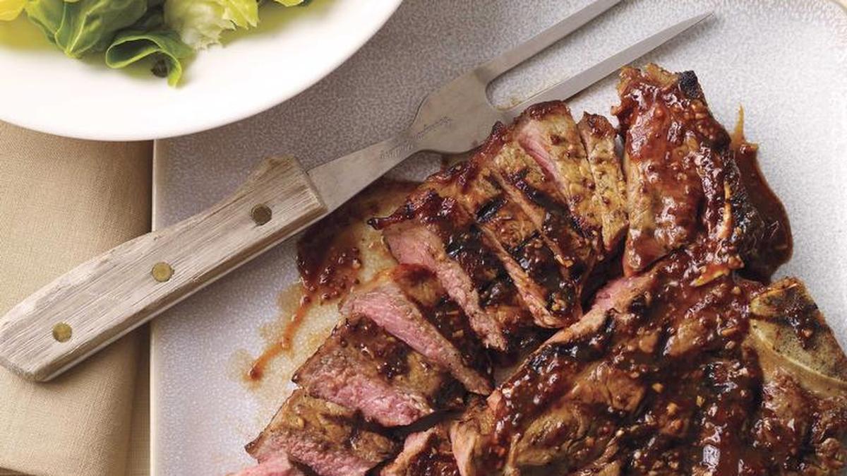 T-Bone Steak with Barbecue Sauce and Boston Lettuce Salad.