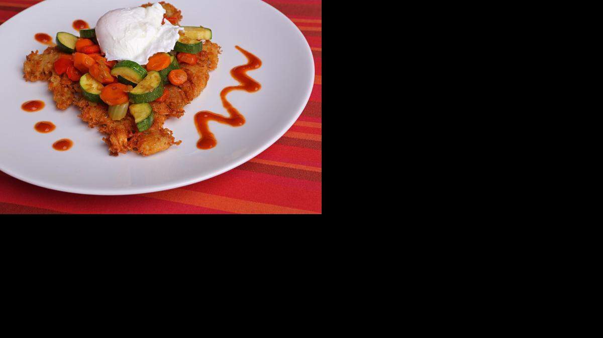 
Hot Veggie Mess: A poached egg sits atop a vegetable-and-potato hash. 
