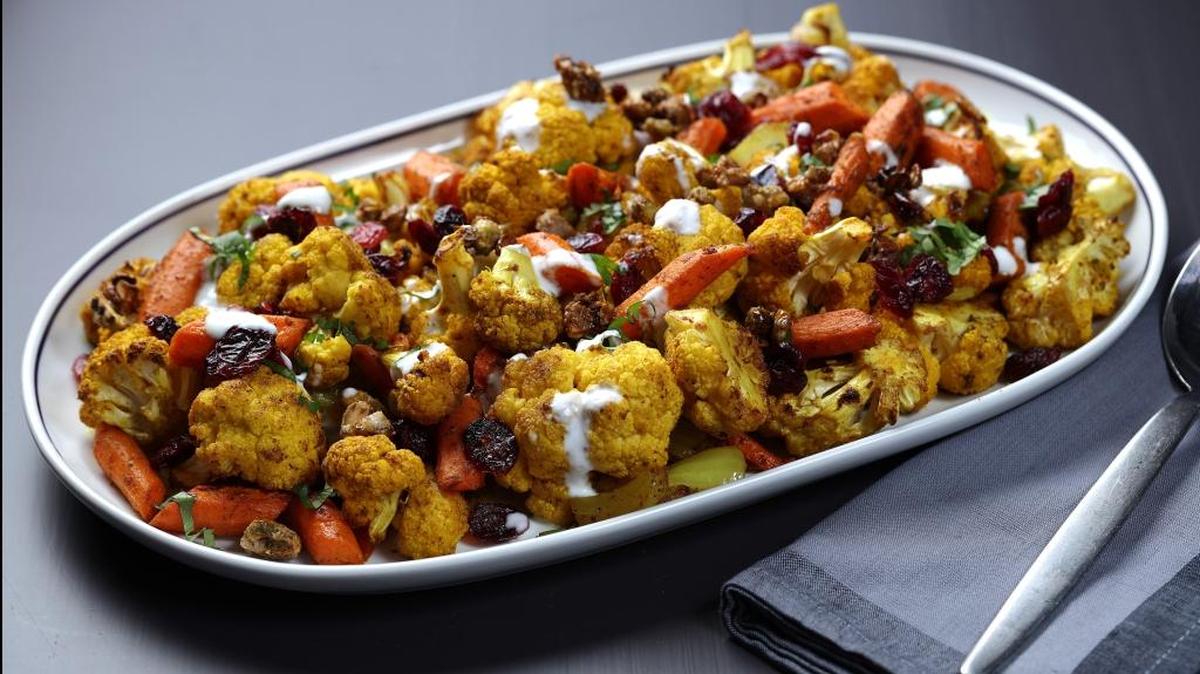 
Cauliflower, carrots and onions come off the grill with a hint of wood smoke. A drizzle of yogurt and a sprinkling of herbs finishes the dish. 

