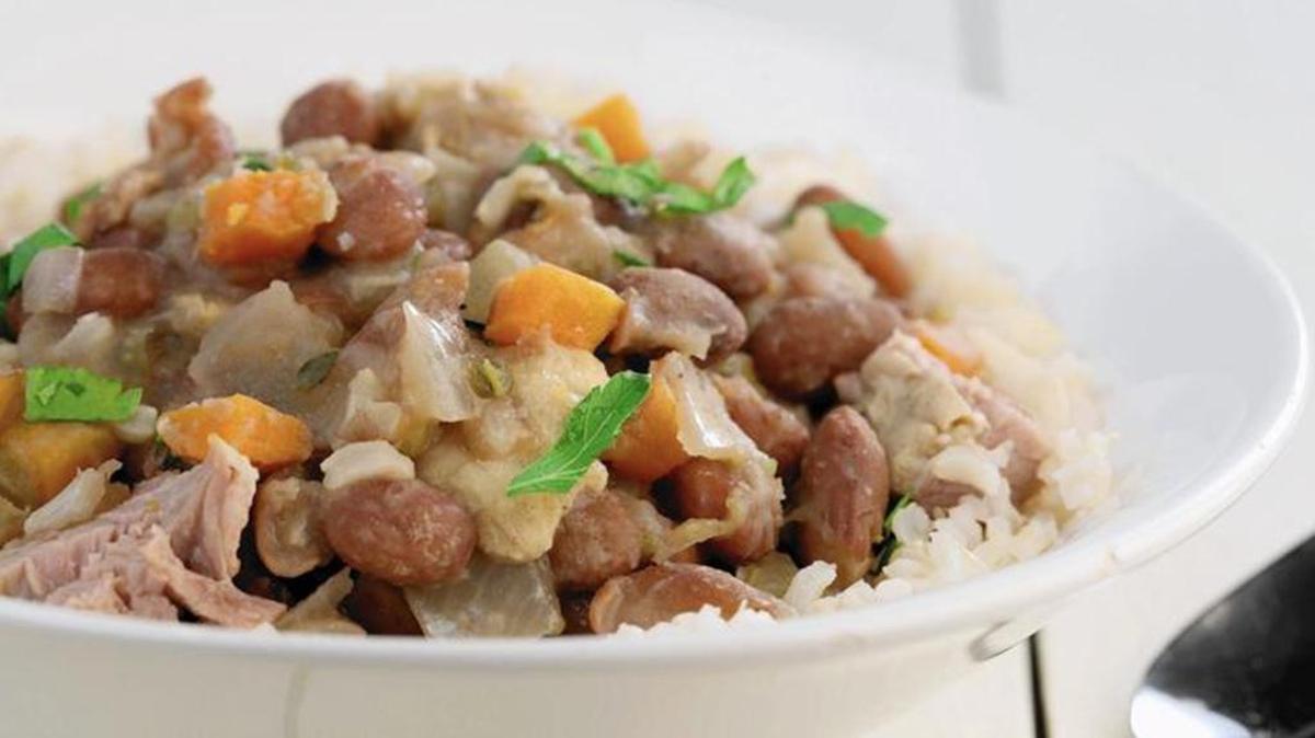 Beans are cooked with plenty of aromatic vegetables for a spin on red beans and rice.