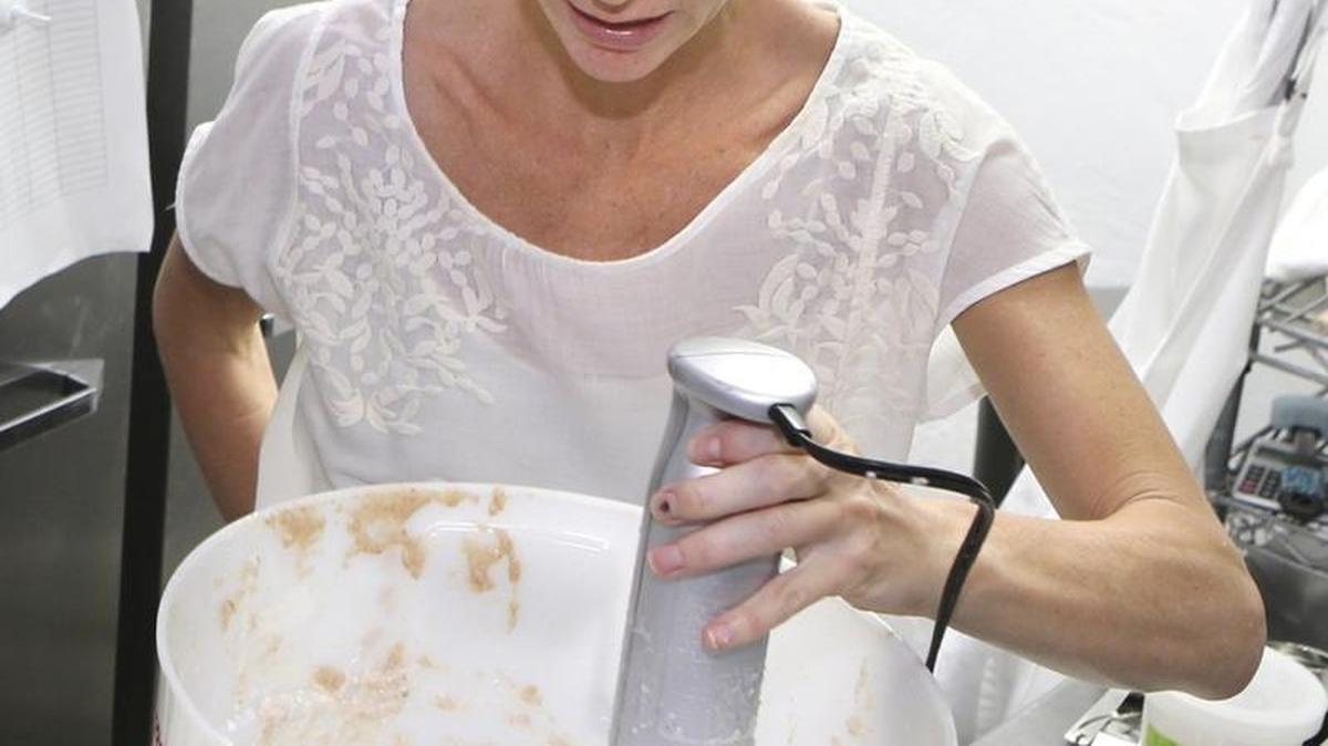 Serendipity Creamery owner Jessica Levison uses an immersion blender to make charoset ice cream.