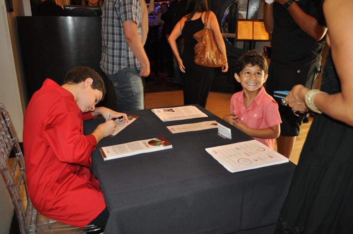 ‘The chef is awesome! His food is so yummy,’ said 5-year-old Ezra Mualem, smiling at right, with Chef Tyler Zager, 13.