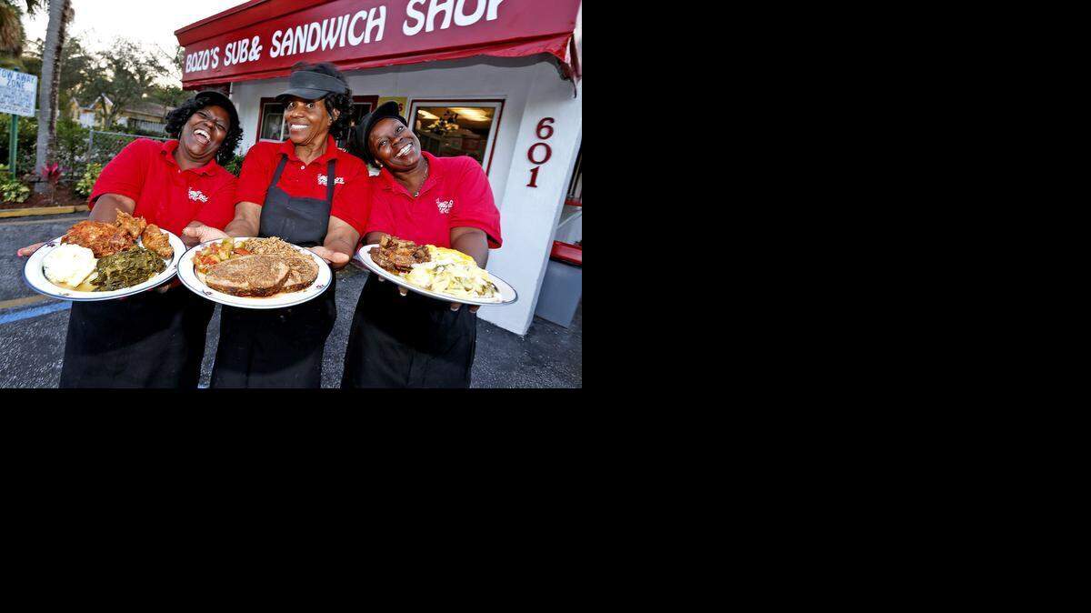 
COME AND GET IT: Eranestine Jones, Rosa “Rosy” Bozeman and Loretta McDougle display some of the soul food at Bozo’s in Fort Lauderdale.


