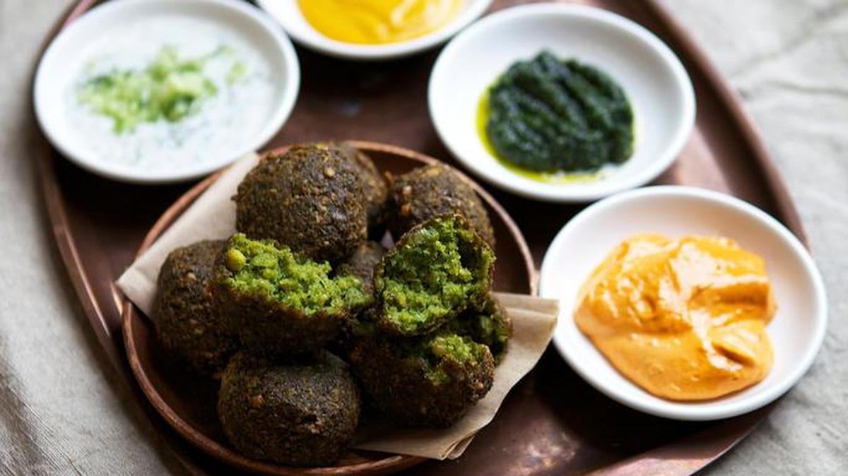 Falafel with dipping sauces.