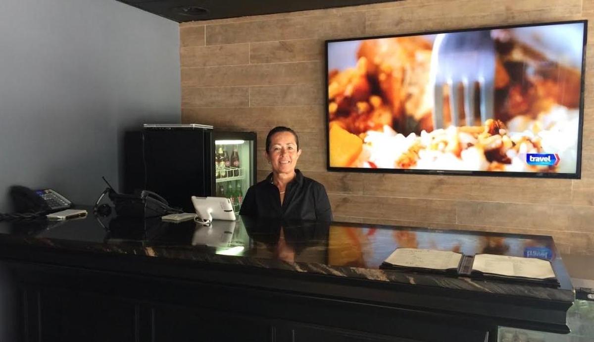 Beatriz Orozco takes pizza orders and works the counter while you wait and watch shows on the giant TV. Her son, Thomas Logan, opened Merrick's Pizza in Coral Gables in December 2016.