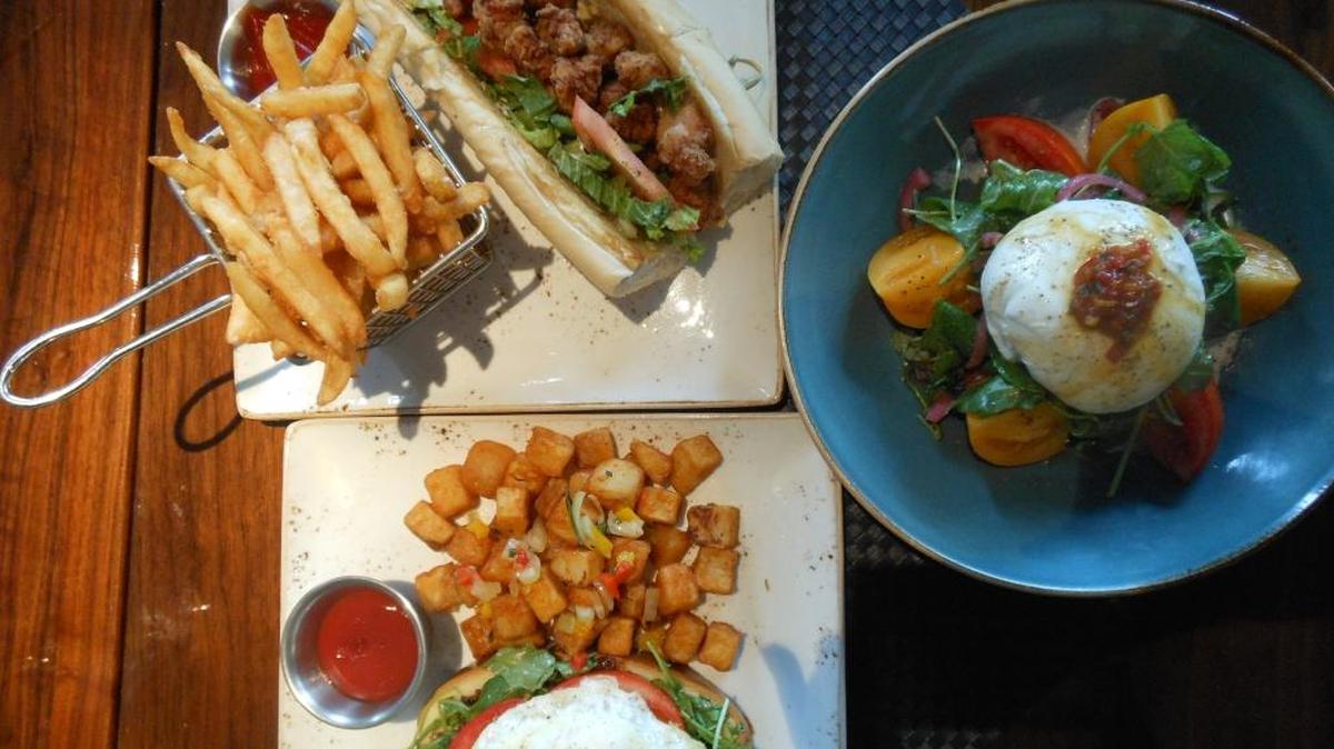Alligator po’ boy and other dishes from The Social Club in Miami Beach.