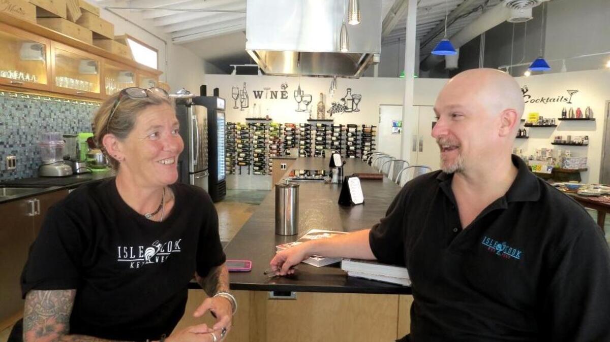 Martha Hubbard, one of the chefs paying tribute to Conch cuisine, talks with Bill Brown, owner of Isle Cook Key West.