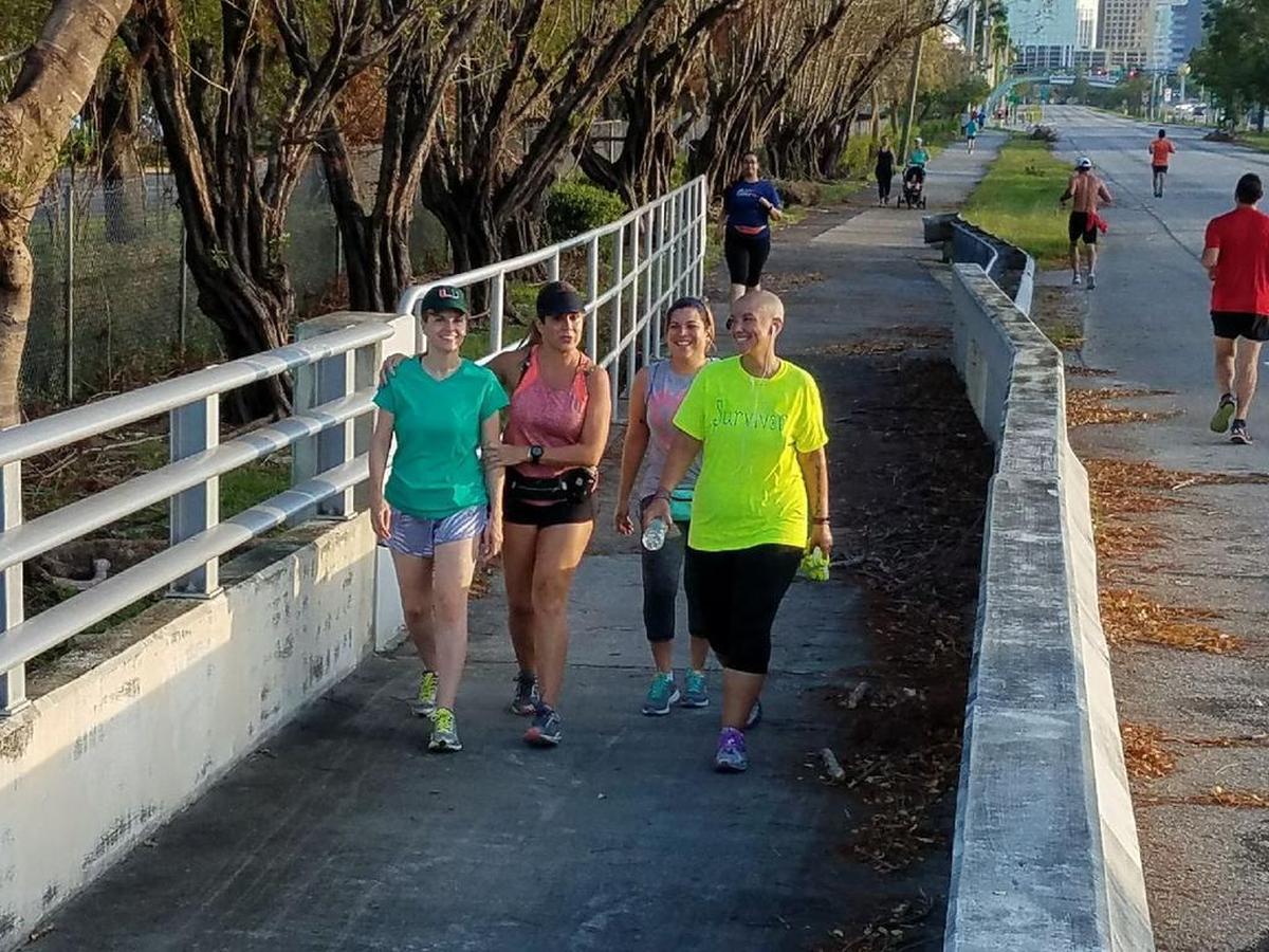 Marta Torres, Lynette Fernandez, Elizabeth Herrera and Abdi Sanz as they train for the Miami Marathon with Team FDC in September on the busway in South Miami-Dade along U.S. 1.