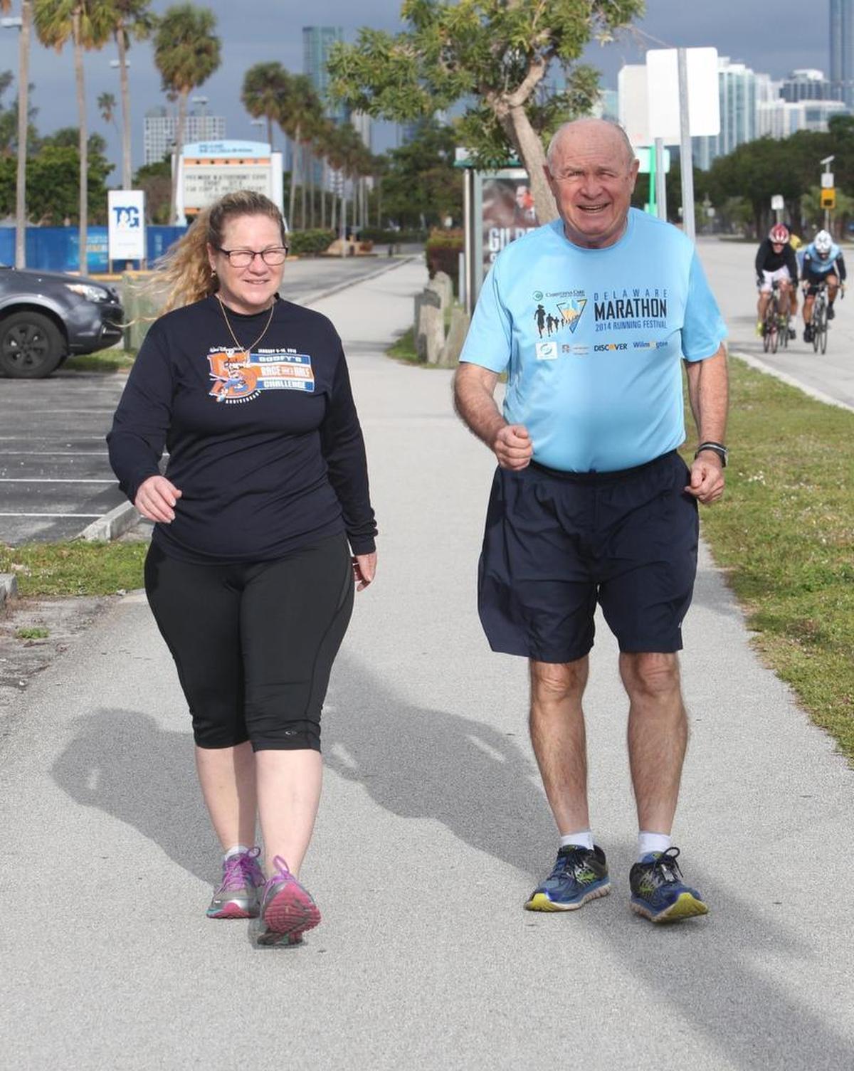 Harry Bateman Blair, known as Bate, trains with his daughter Kathy Gonzalez, in Key Biscayne on Saturday. Blair, 77, was diagnosed with prostate cancer in the fall of 2016. He will walk the 13.1-mile half marathon at the Fitbit Miami Marathon and Half Marathon on Sunday.